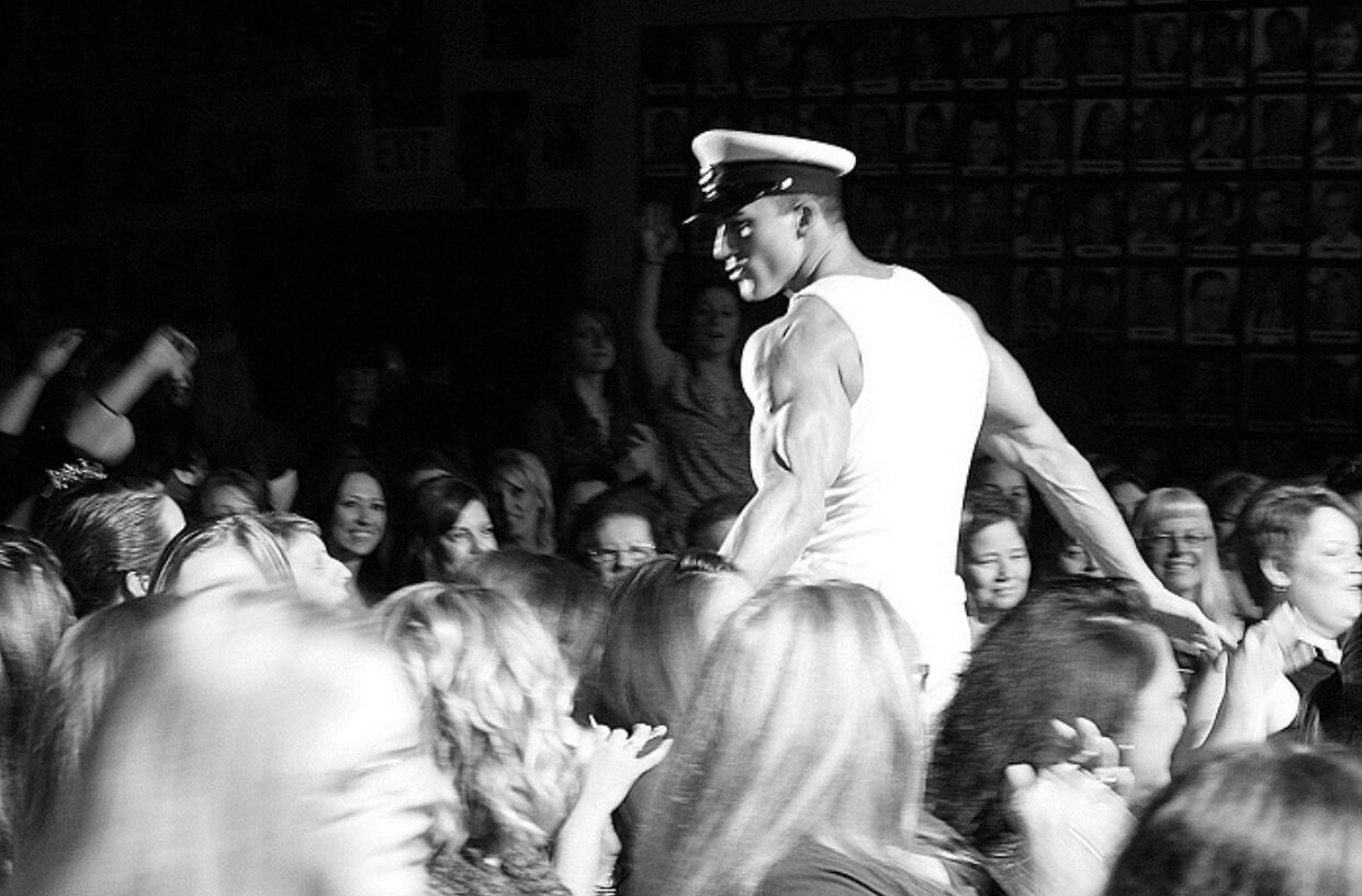 Thomas Rooney (Tom Rooney), author, entrepreneur, and former headline performer during a live performance in his Naval Officer outfit, author of Reflections of a Male Revue Headliner: How to Win at Life and Love